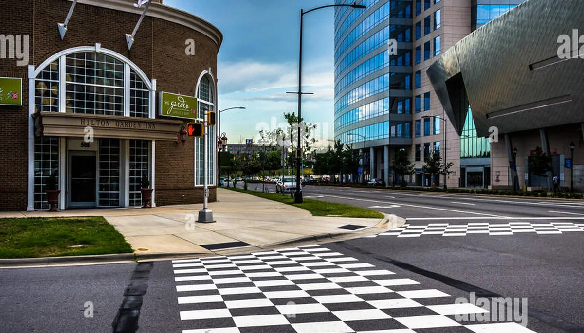 Busy Charlotte NC intersection with pedestrian crosswalks where accidents frequently occur